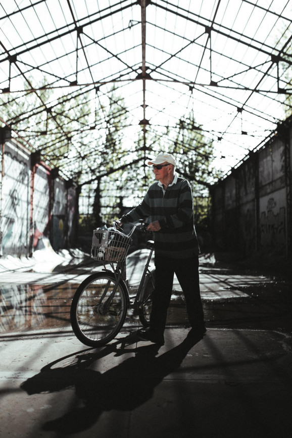 A man pushes his bike.